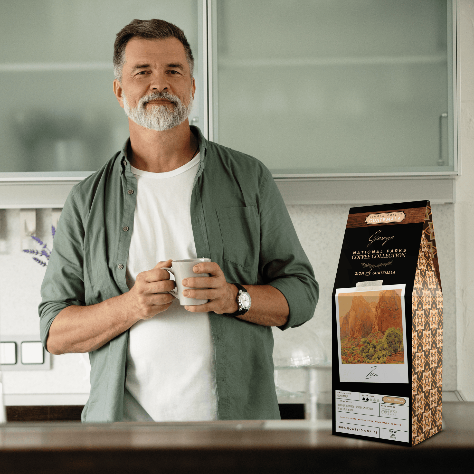 Single-origin specialty coffee from Guatemala in collectible GEORGE National Parks Collection packaging by Official Fellow Citizen. Scene of man holding cup of coffee in kitchen. - Certified by Mintall.