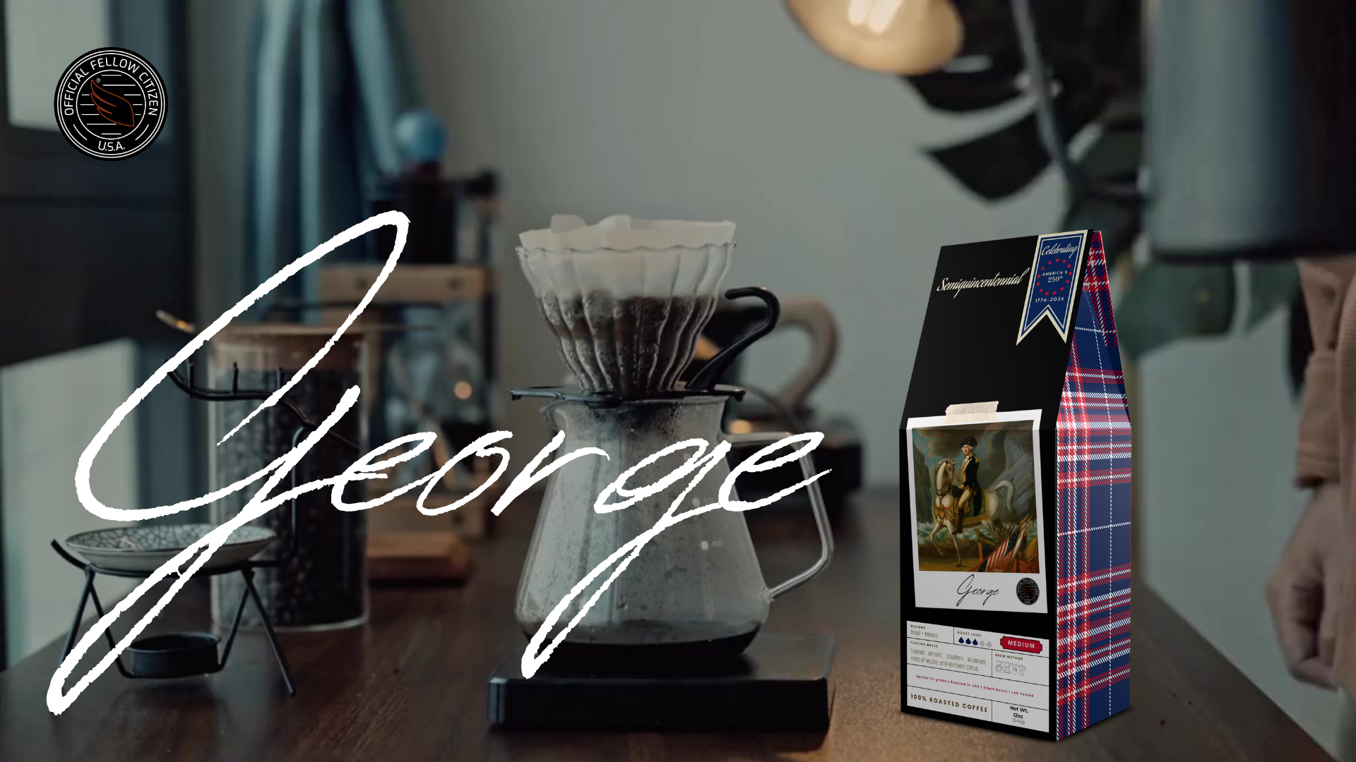 Load video: How to video of a Hario V60 pourover with specialty grade coffee. A box of George Coffee with a Polaroid framed image of George Washington on horse is next to the coffee pot on a wood table.